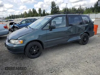 1997 Honda Odyssey with VIN JHMRA1847VC014113, listed as a Copart auction lot 59270225 with 118,136 mi miles and Salvage title. Bid and sale history available at DreamBid. Image 1.