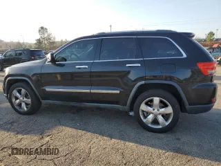 2011 Jeep Grand Cherokee Overland with VIN 1J4RS6GT5BC648076, listed as a Copart auction lot 48878135 with 223,263 mi miles and Salvage Title. Bid and sale history available at DreamBid. Image 2.