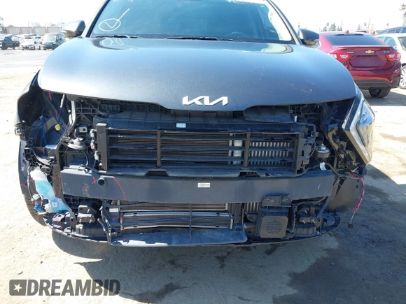 2023 Kia Sportage EX with VIN KNDPVCAG8P7019572, listed as a IAAI auction lot 42226335 with 68,583 mi miles and . Bid and sale history available at DreamBid. Image 6.