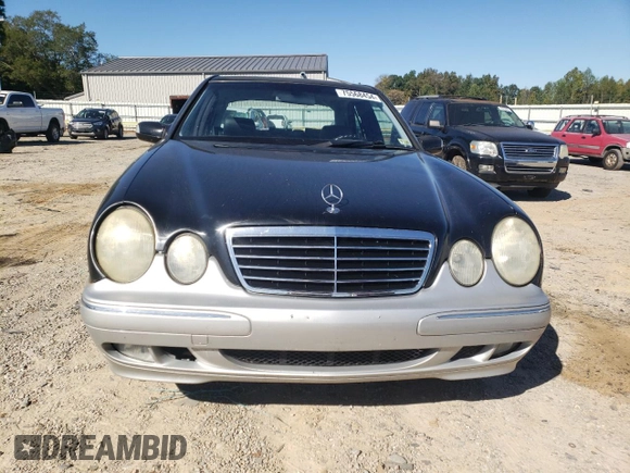 2000 Mercedes-Benz E-Class AWD with VIN WDBJF82JXYX035315, listed as a Copart auction lot 75568454 with 166,704 mi miles and Salvage Title. Bid and sale history available at carsss.com. Image 5.