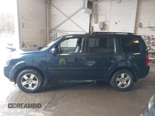 2011 Honda Pilot EX-L with VIN 5FNYF4H66BB020176, listed as a IAAI auction lot 41973659 with 238,745 mi miles and . Bid and sale history available at carsss.com. Image 14.