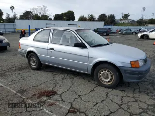 1996 Toyota Tercel DX z VIN JT2AC52L2T0137695, wystawiony jako Copart lot #86535844 z przebiegiem 246 554 mil mil oraz Czysty tytuł • Clean title. Historia ofert i sprzedaży dostępna na DreamBid. Obrazek 4.