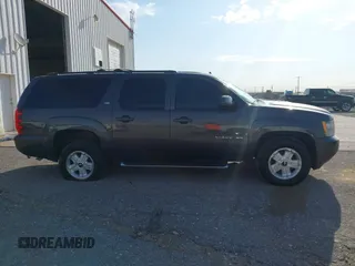 2011 Chevrolet Suburban LT with VIN 1GNSKJE34BR242629, listed as a IAAI auction lot 42043276 with 197,722 mi miles. Bid and sale history available at carsss.com. Image 13.