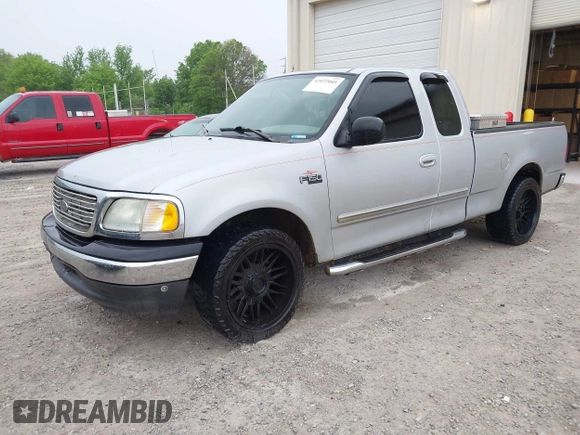 2003 Ford F-150 XL with VIN 1FTRX17253NA74389, listed as a IAAI auction lot 42072045 with 166,572 mi miles. Bid and sale history available at carsss.com. Image 2.