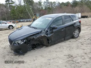 2016 Mazda CX-5 Touring z VIN JM3KE4CY6G0605869, wystawiony jako Copart lot #50969725 z przebiegiem 189 290 mil mil oraz Szkoda całkowita • Salvage title. Historia ofert i sprzedaży dostępna na DreamBid. Obrazek 1.
