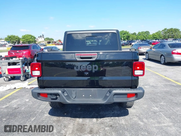 2021 Jeep Gladiator Willys with VIN 1C6HJTAGXML613431, listed as a IAAI auction lot 42180502 with 64,572 mi miles and . Bid and sale history available at DreamBid. Image 16.
