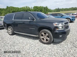 2015 Chevrolet Suburban LT with VIN 1GNSKJKC7FR532678, listed as a Copart auction lot 53715265 with 190,927 mi miles and Salvage Title. Bid and sale history available at DreamBid. Image 4.