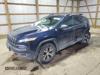 2014 Jeep Cherokee Trailhawk with VIN 1C4PJMBB9EW124371, listed as a Copart auction lot 42038105 with 137,717 mi miles and Salvage Title. Bid and sale history available at carsss.com. Image 1.