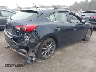2018 Mazda 3 Touring with VIN 3MZBN1L34JM204883, listed as a IAAI auction lot 41094541 with 125,205 mi miles and . Bid and sale history available at DreamBid. Image 4.