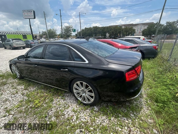 2012 Audi A8 z VIN WAURVAFD6CN015907, wystawiony jako Copart lot #59188515 z przebiegiem 112 879 mil mil oraz Czysty tytuł • Clean title. Historia ofert i sprzedaży dostępna na DreamBid. Obrazek 3.