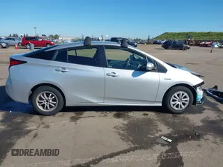 2021 Toyota Prius L Eco with VIN JTDKAMFU5M3130478, listed as a IAAI auction lot 41867606 with 52,223 mi miles. Bid and sale history available at carsss.com. Image 14.