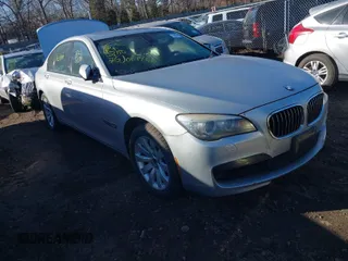 2014 BMW 7 Series 740i with VIN WBAYA6C54ED144450, listed as a IAAI auction lot 41680060 with 999,999 mi miles. Bid and sale history available at carsss.com. Image 1.