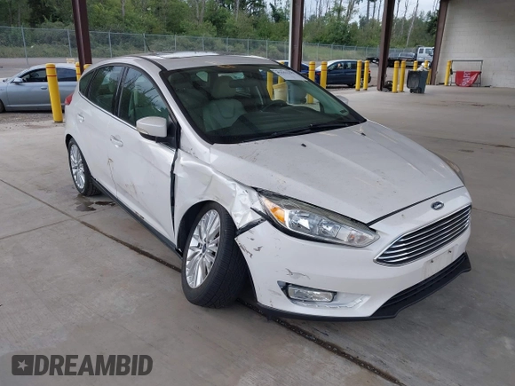 2018 Ford Focus Titanium z VIN 1FADP3N27JL314856, wystawiony jako IAAI lot #42553390 z przebiegiem 82 936 mil mil oraz . Historia ofert i sprzedaży dostępna na DreamBid. Obrazek 1.