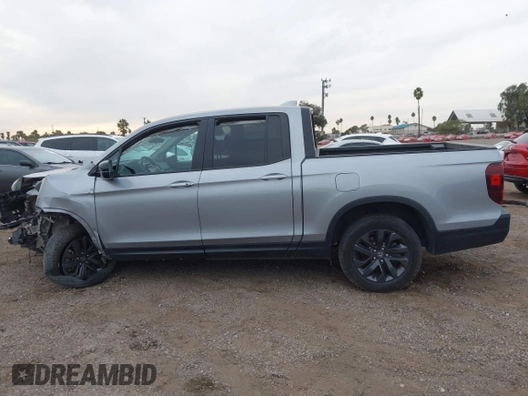 2023 Honda Ridgeline Sport z VIN 5FPYK3F16PB049866, wystawiony jako IAAI lot #41068916 z przebiegiem Nie podano mil oraz . Historia ofert i sprzedaży dostępna na DreamBid. Obrazek 14.