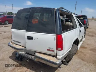 1999 GMC Suburban with VIN 1GDFK16R0XJ728255, listed as a IAAI auction lot 42230595 with Not provided miles and . Bid and sale history available at DreamBid. Image 4.