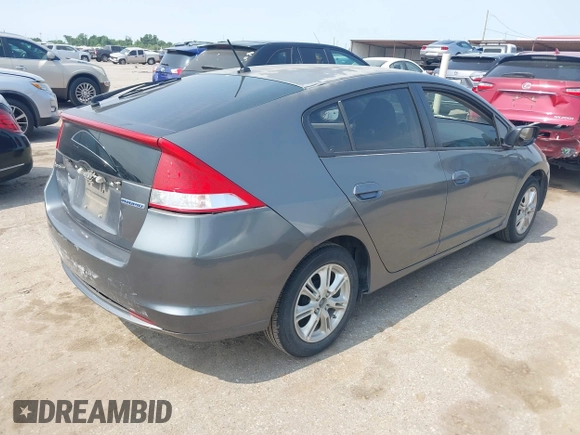 2010 Honda Insight EX with VIN JHMZE2H71AS043465, listed as a IAAI auction lot 42312556 with 151,009 mi miles and . Bid and sale history available at DreamBid. Image 4.