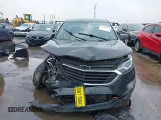 2018 Chevrolet Equinox LT z VIN 2GNAXSEV0J6272001, wystawiony jako IAAI lot #42185011 z przebiegiem 108 899 mil mil oraz . Historia ofert i sprzedaży dostępna na DreamBid. Obrazek 12.