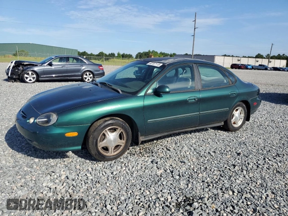 1999 Ford Taurus SE with VIN 1FAFP53U2XG184723, listed as a Copart auction lot 60787115 with 128,277 mi miles and Salvage title. Bid and sale history available at DreamBid. Image 1.