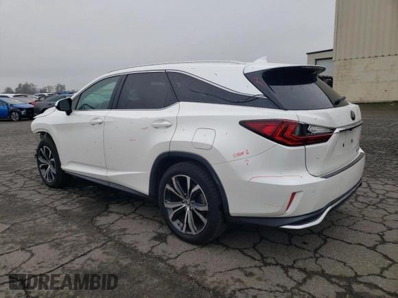 2020 Lexus RX 350L with VIN JTJHZKEA6L2014576, listed as a Copart auction lot 82706154 with 59,775 mi miles and Salvage title. Bid and sale history available at DreamBid. Image 2.