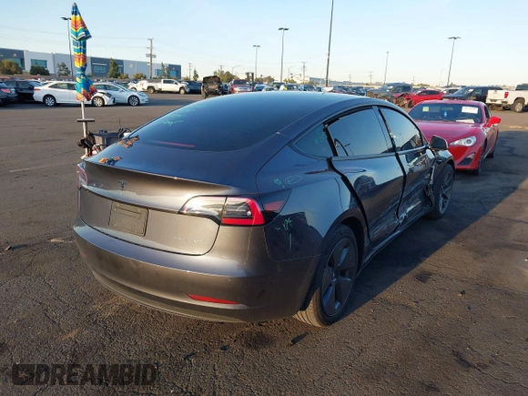 2021 Tesla Model 3 Long Range with VIN 5YJ3E1EBXMF995814, listed as a IAAI auction lot 41838453 with 51,415 mi miles. Bid and sale history available at carsss.com. Image 4.