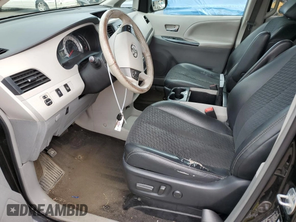 2014 Toyota Sienna SE with VIN 5TDXK3DC7ES425945, listed as a Copart auction lot 63067955 with 173,815 mi miles and Salvage title. Bid and sale history available at DreamBid. Image 7.
