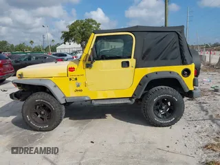 2002 Jeep Wrangler X z VIN 1J4FA39S82P719241, wystawiony jako IAAI lot #42150742 z przebiegiem 147 914 mil mil oraz . Historia ofert i sprzedaży dostępna na DreamBid. Obrazek 14.