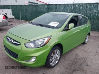 2013 Hyundai Accent SE with VIN KMHCU5AEXDU069586, listed as a IAAI auction lot 40968974 with 98,939 mi miles. Bid and sale history available at carsss.com. Image 2.