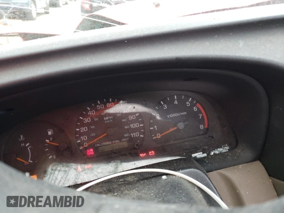 1999 Nissan Frontier XE with VIN 1N6ED26Y4XC313142, listed as a Copart auction lot 85777354 with 122,822 mi miles and Salvage title. Bid and sale history available at DreamBid. Image 9.