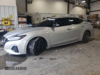 2021 Nissan Maxima SV z VIN 1N4AA6CV3MC506265, wystawiony jako Copart lot #51985105 z przebiegiem 99 697 mil mil oraz Czysty tytuł • Clean title. Historia ofert i sprzedaży dostępna na DreamBid. Obrazek 1.