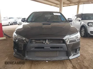 2013 Mitsubishi Lancer Evolution GSR with VIN JA32W8FV6DU009257, listed as a IAAI auction lot 41917942 with 125,279 mi miles. Bid and sale history available at carsss.com. Image 6.