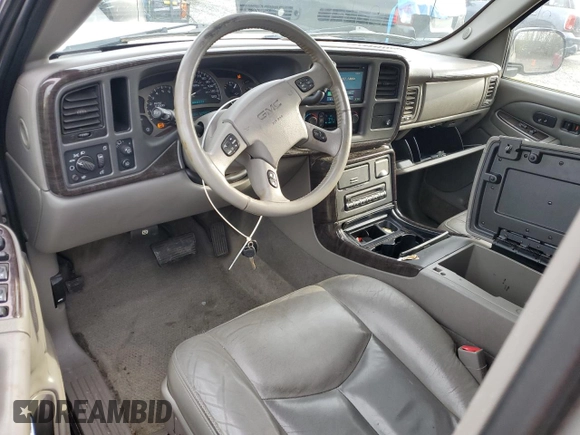 2005 GMC Yukon Denali z VIN 1GKEK63U65J262371, wystawiony jako Copart lot #52773425 z przebiegiem 129 028 mil mil oraz Czysty tytuł • Clean title. Historia ofert i sprzedaży dostępna na DreamBid. Obrazek 8.