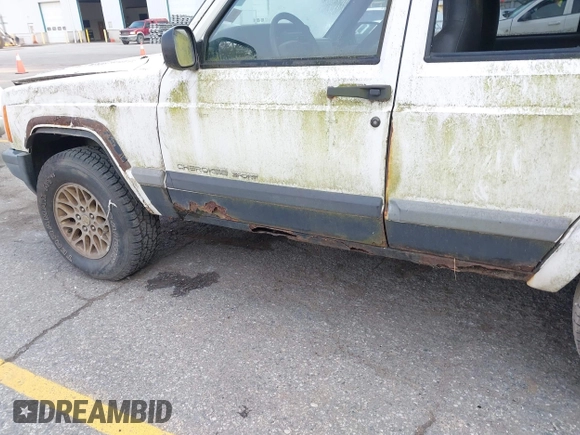 1999 Jeep Cherokee Sport z VIN 1J4FF68S0XL663735, wystawiony jako IAAI lot #42463562 z przebiegiem Nie podano mil oraz . Historia ofert i sprzedaży dostępna na DreamBid. Obrazek 12.