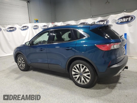2020 Ford Escape Titanium z VIN 1FMCU9J98LUA93393, wystawiony jako Copart lot #65366925 z przebiegiem 74 750 mil mil oraz Czysty tytuł • Clean title. Historia ofert i sprzedaży dostępna na DreamBid. Obrazek 2.