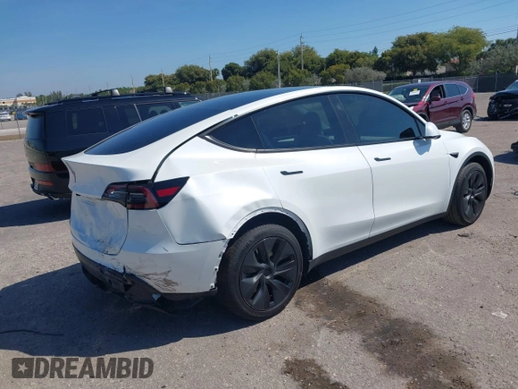 2024 Tesla Model Y with VIN 7SAYGDED9RF161420, listed as a IAAI auction lot 41892788 with 12,353 mi miles and . Bid and sale history available at DreamBid. Image 4.