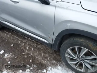 2019 Hyundai Santa Fe Ultimate with VIN 5NMS5CAD1KH000394, listed as a IAAI auction lot 41455421 with 42,886 mi miles and . Bid and sale history available at DreamBid. Image 18.