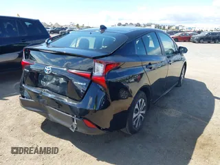 2021 Toyota Prius L Eco with VIN JTDKAMFU6M3135799, listed as a IAAI auction lot 42064241 with 77,120 mi miles and . Bid and sale history available at DreamBid. Image 4.