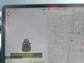 2023 Tesla Model Y Performance z VIN 7SAYGDEF6PF774965, wystawiony jako IAAI lot #41655550 z przebiegiem 33 824 mil mil oraz . Historia ofert i sprzedaży dostępna na DreamBid. Obrazek 7.