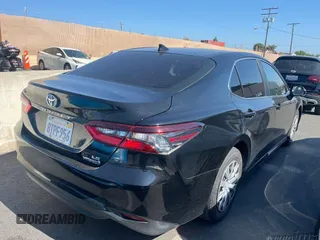 2021 Toyota Camry Hybrid LE with VIN 4T1C31AK1MU551719, listed as a IAAI auction lot 42273330 with 67,589 mi miles and . Bid and sale history available at DreamBid. Image 1.
