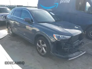 2019 Audi Q3 Premium with VIN WA1AECF34K1077065, listed as a IAAI auction lot 40826923 with 85,458 mi miles. Bid and sale history available at carsss.com. Image 1.