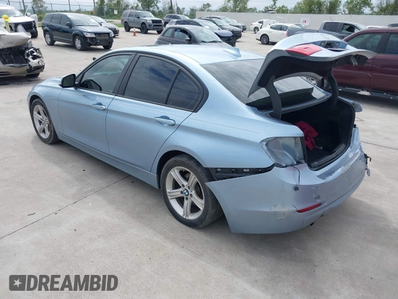 2013 BMW 3 Series 320i with VIN WBA3B1C54DK128284, listed as a IAAI auction lot 40315808 with 136,104 mi miles. Bid and sale history available at carsss.com. Image 3.
