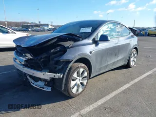 2020 Tesla Model Y Long Range with VIN 5YJYGDEE4LF030103, listed as a IAAI auction lot 41328929 with 64,896 mi miles and . Bid and sale history available at DreamBid. Image 2.