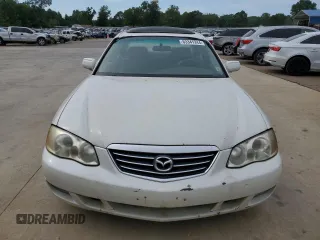 2001 Mazda Millenia z VIN JM1TA221911717066, wystawiony jako Copart lot #63341244 z przebiegiem 234 263 mil mil oraz Szkoda całkowita • Salvage title. Historia ofert i sprzedaży dostępna na DreamBid. Obrazek 5.