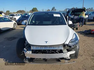 2023 Tesla Model Y Long Range with VIN 7SAYGDEE1PA128818, listed as a IAAI auction lot 41622062 with 19,089 mi miles. Bid and sale history available at carsss.com. Image 13.