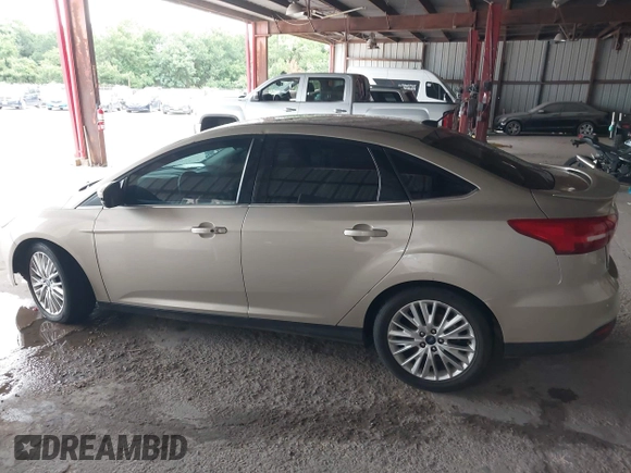 2017 Ford Focus Titanium with VIN 1FADP3J26HL279839, listed as a IAAI auction lot 42466826 with 202,795 mi miles and . Bid and sale history available at DreamBid. Image 14.