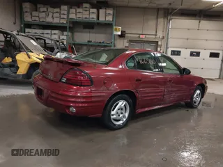 2002 Pontiac Grand Am SE z VIN 1G2NE52F92C291335, wystawiony jako IAAI lot #41665150 z przebiegiem 75 552 mil mil oraz . Historia ofert i sprzedaży dostępna na DreamBid. Obrazek 4.