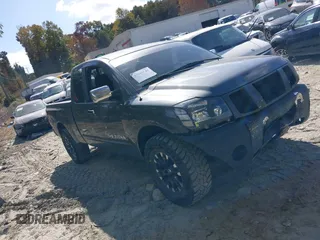 2005 Nissan Titan XE with VIN 1N6BA06A95N573086, listed as a IAAI auction lot 37915149 with 213,488 mi miles and . Bid and sale history available at DreamBid. Image 1.