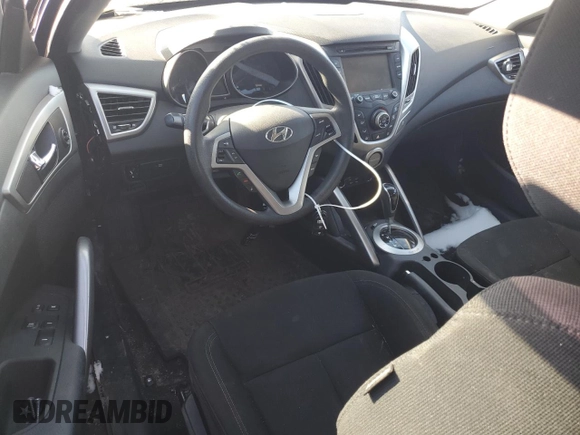 2016 Hyundai Veloster z VIN KMHTC6AD6GU304196, wystawiony jako Copart lot #43694185 z przebiegiem 63 516 mil mil oraz Szkoda całkowita • Salvage title. Historia ofert i sprzedaży dostępna na DreamBid. Obrazek 8.