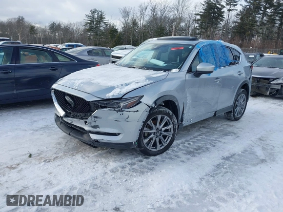 2021 Mazda CX-5 Grand Touring Reserve with VIN JM3KFBAY0M0377030, listed as a IAAI auction lot 41606709 with 39,590 mi miles. Bid and sale history available at carsss.com. Image 2.