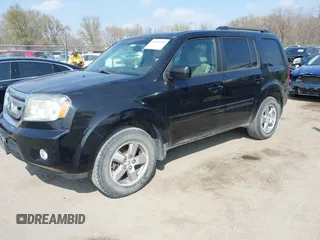 2009 Honda Pilot EX-L with VIN 5FNYF48529B035128, listed as a IAAI auction lot 42006450 with 214,069 mi miles. Bid and sale history available at carsss.com. Image 2.