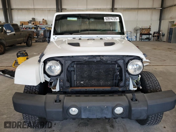2015 Jeep Wrangler Unlimited Sahara with VIN 1C4BJWEG2FL620001, listed as a Copart auction lot 63914725 with 114,810 mi miles and Salvage title. Bid and sale history available at DreamBid. Image 5.